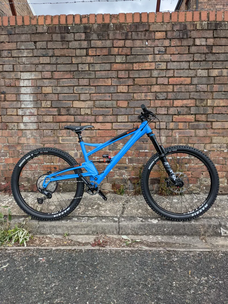 Orange and blue mountain bike 2025